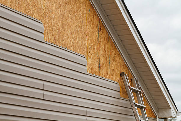 Professional Emergency Siding Repair technician working in Greenville, IN
